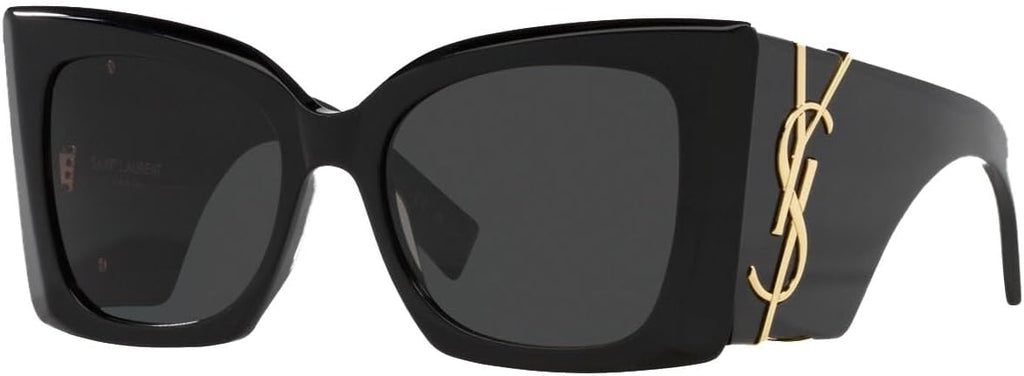Saint Laurent oversized sunglasses with a glossy black frame, dark lenses, and a gold-tone YSL logo on the temple arm.