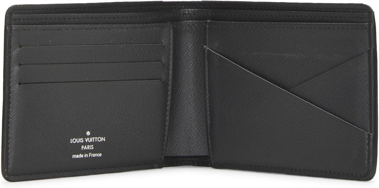 Black Louis Vuitton wallet open on a white background
