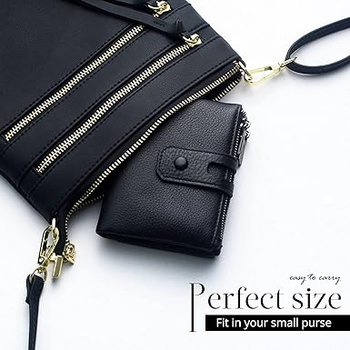 Black leather crossbody bag with gold zippers on a white background