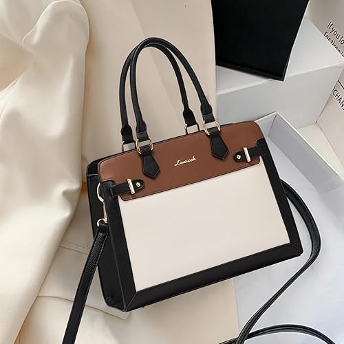 Brown and beige handbag with black strap on a white surface