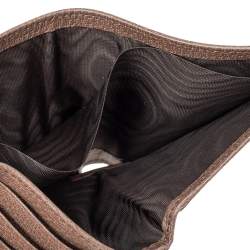 Close-up of a brown leather bag with a textured interior.