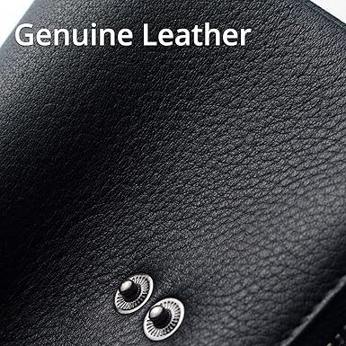 Close-up of black leather surface with 'Genuine Leather' text above it.