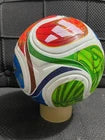 Colorful sports ball with visible branding on a white background