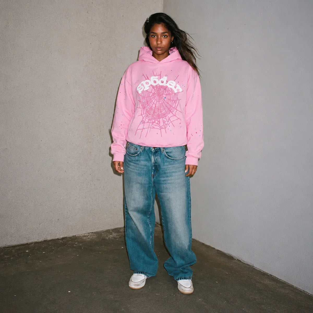 Pink Sp5der Web Hoodie by THE EA STORE, featuring a bold web design, long sleeves, and a casual streetwear style.