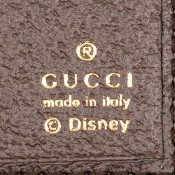 Gucci logo with 'made in Italy' and Disney copyright symbol on a textured background