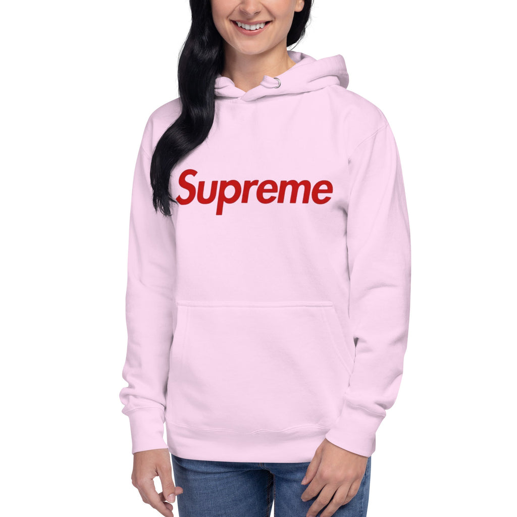 Person wearing a pink hoodie with 'Supreme' logo on a white background