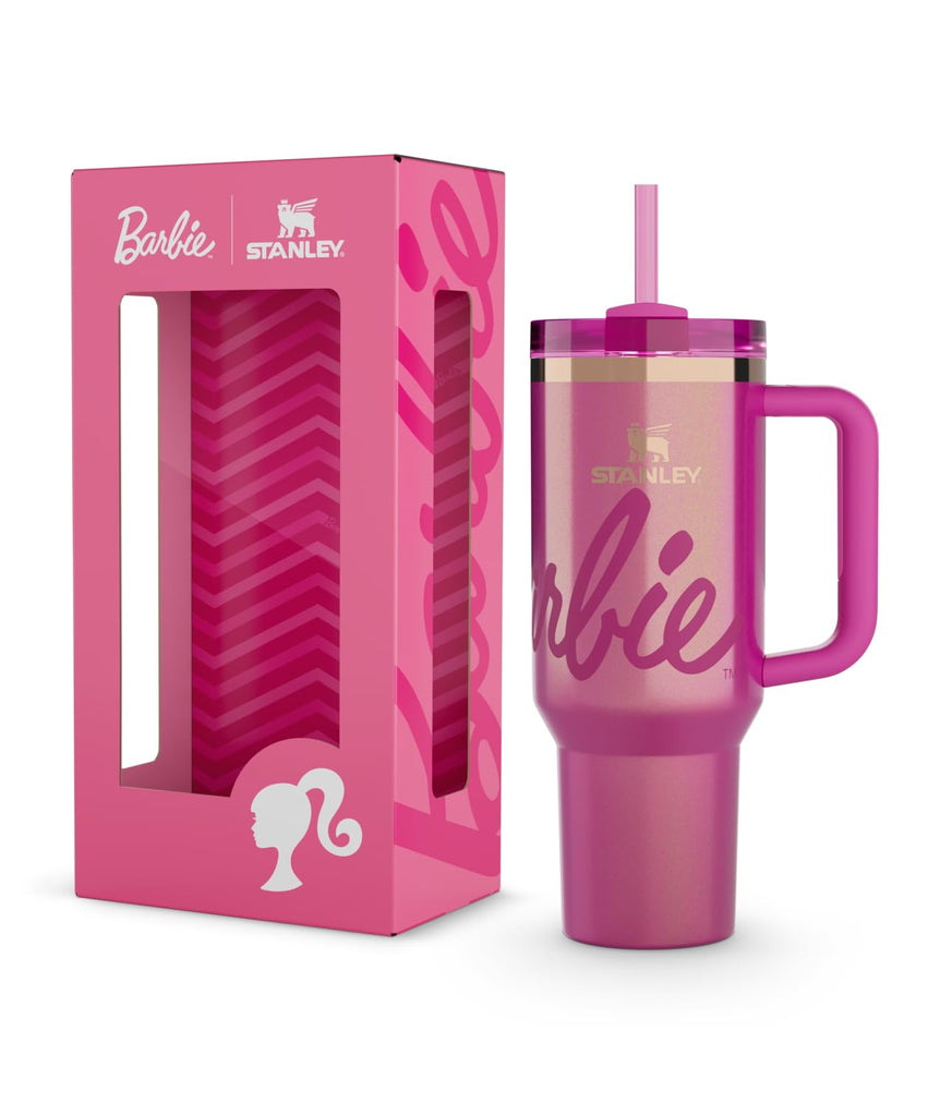 Pink Stanley tumbler with handle and straw in packaging, featuring Barbie branding.