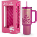 Pink Stanley tumbler with handle and straw lid next to its packaging