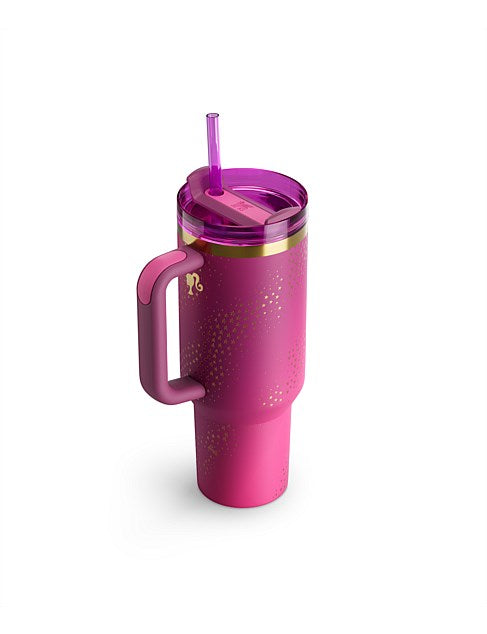 Pink tumbler with handle and straw on a white background