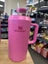 Pink water bottle with a straw on a white background