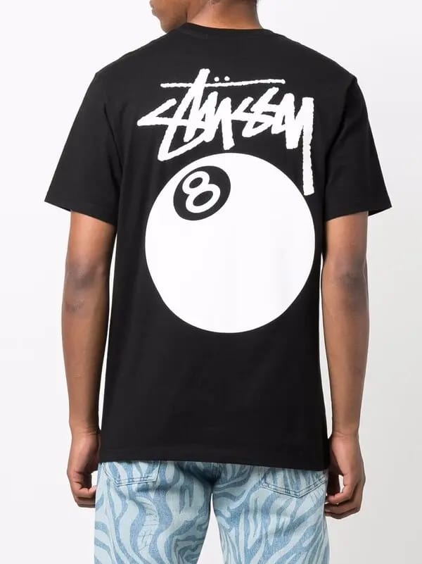 Black Stüssy Classic 8-Ball Graphic Tee featuring bold 8-ball design on a casual essentials T-shirt.