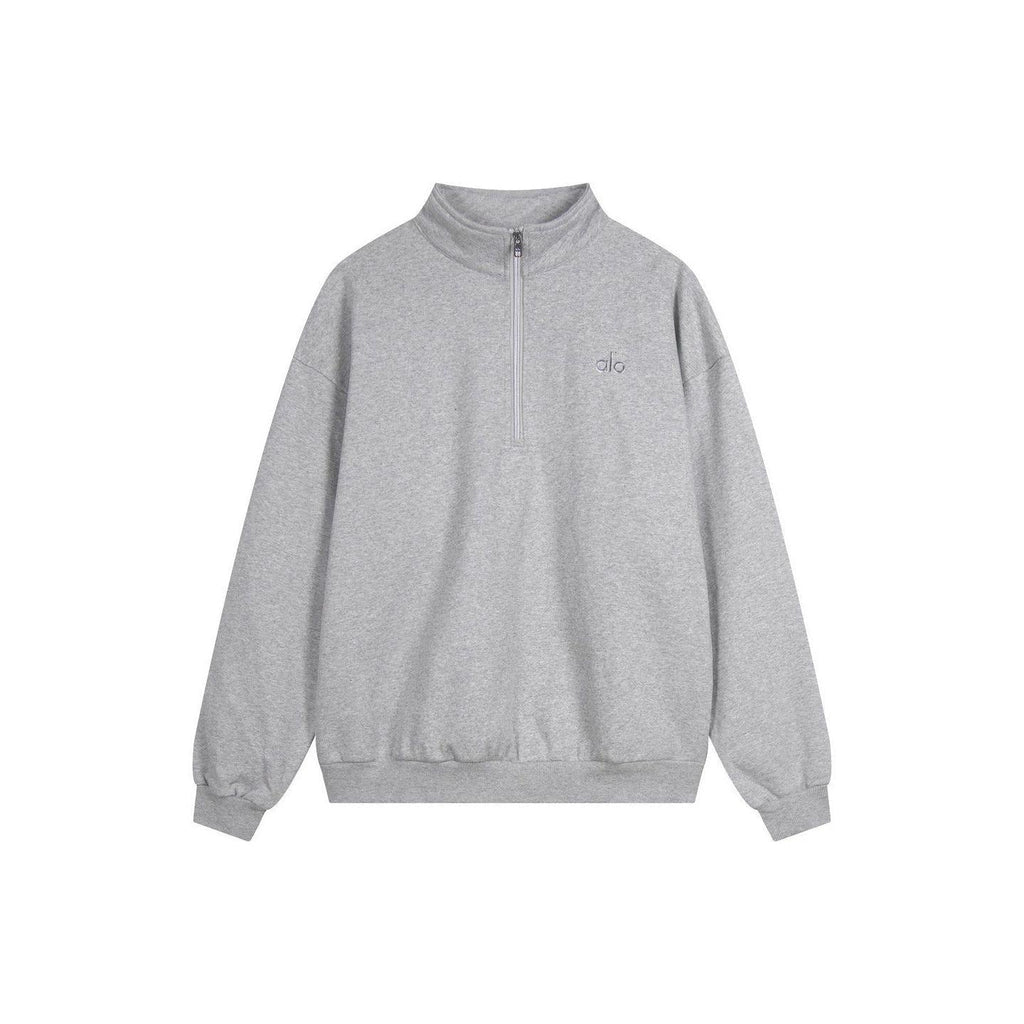 Heather grey Alo Yoga men's and women's half-zip fleece sweatshirt with quarter-zip collar and soft fleece material.