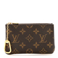 Louis Vuitton Monogram leather key pouch and coin purse with key chain set, featuring classic designer monogram pattern and compact style.