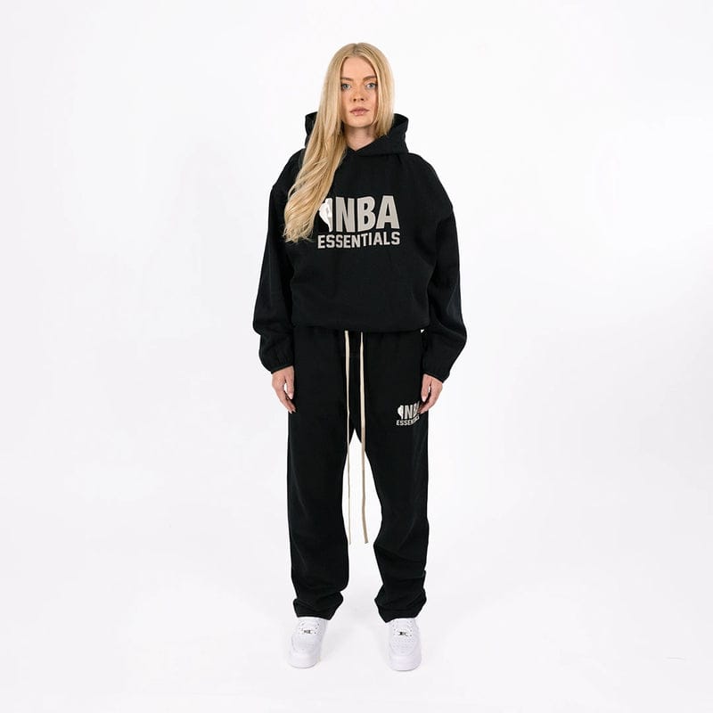 Black Fear of God Essentials NBA hoodie featuring logo details, casual fit, and comfortable fabric from THE EA STORE.