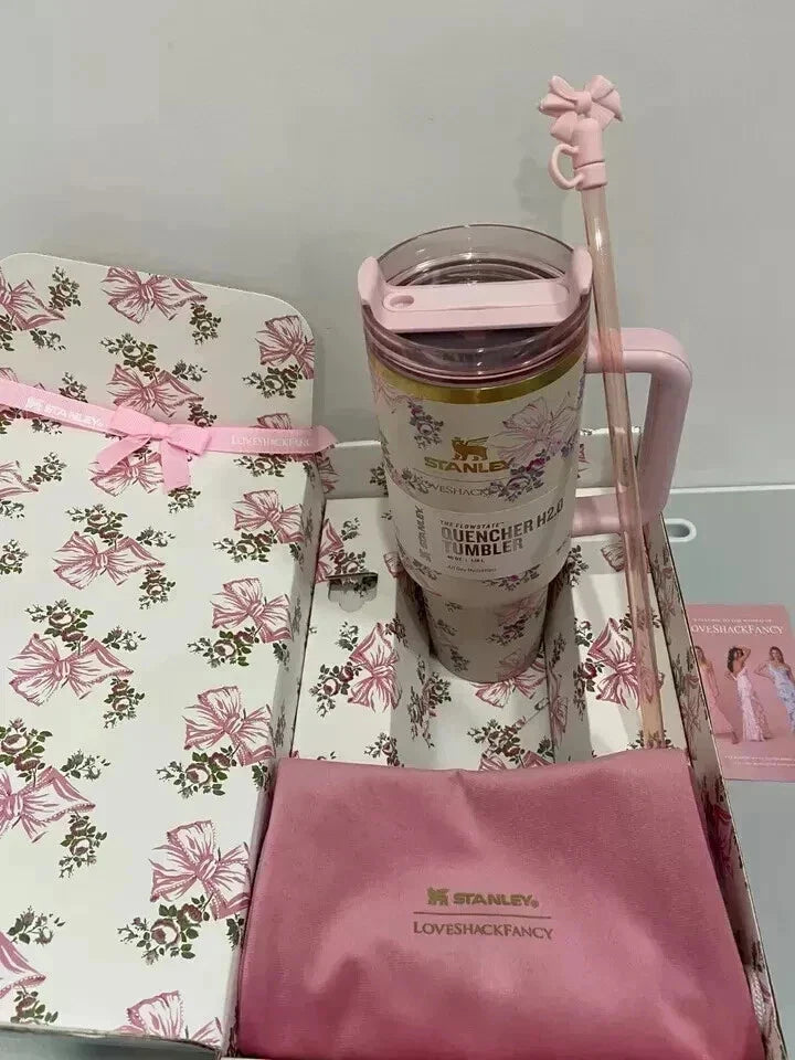  floral-patterned mug with matching towel on a light gray background