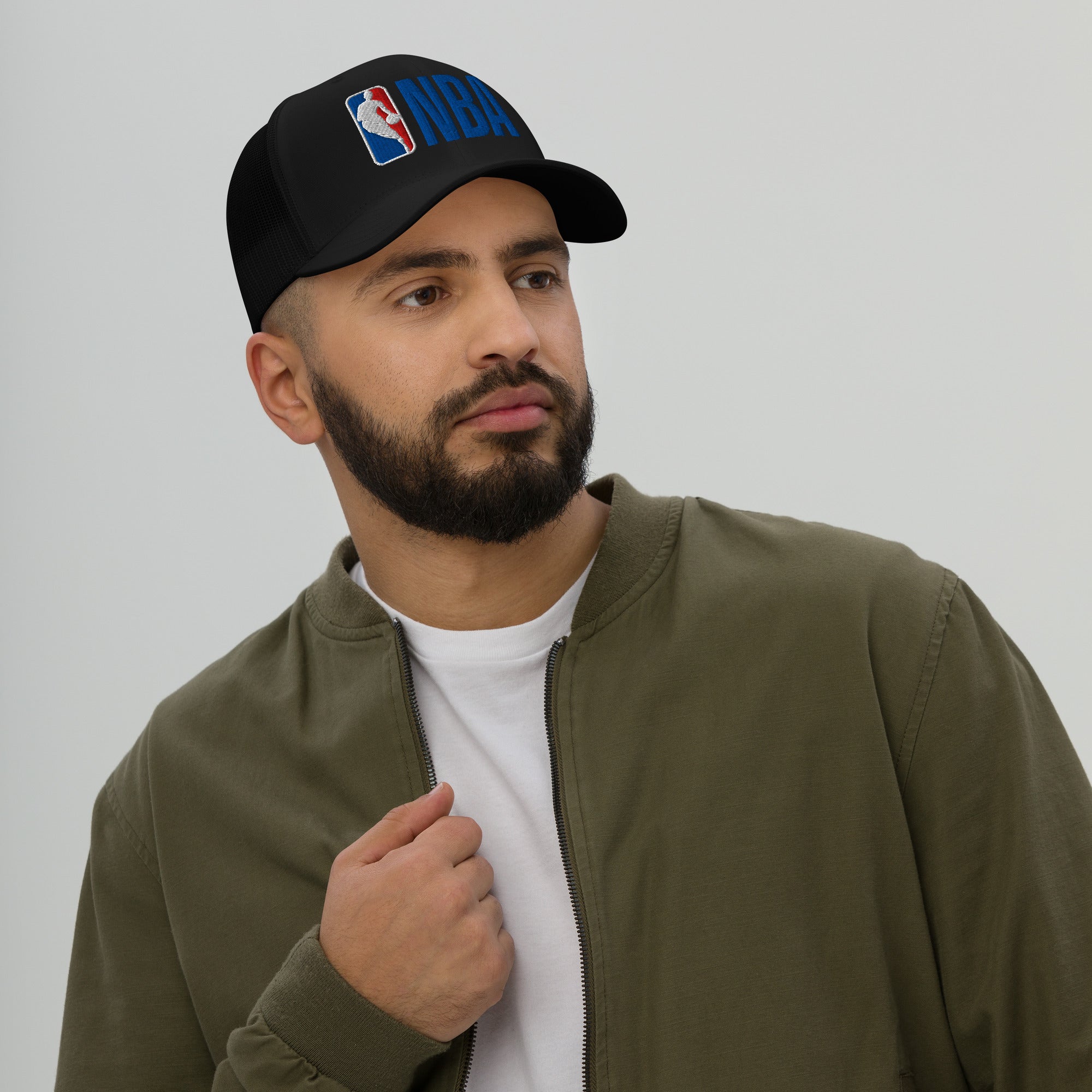 Man wearing a navy cap with 'HIGH' in red on a plain background