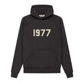 Fear of God Essentials 1977 Hoodie in iron color, casual fit, with hood and front pocket, from THE EA STORE.