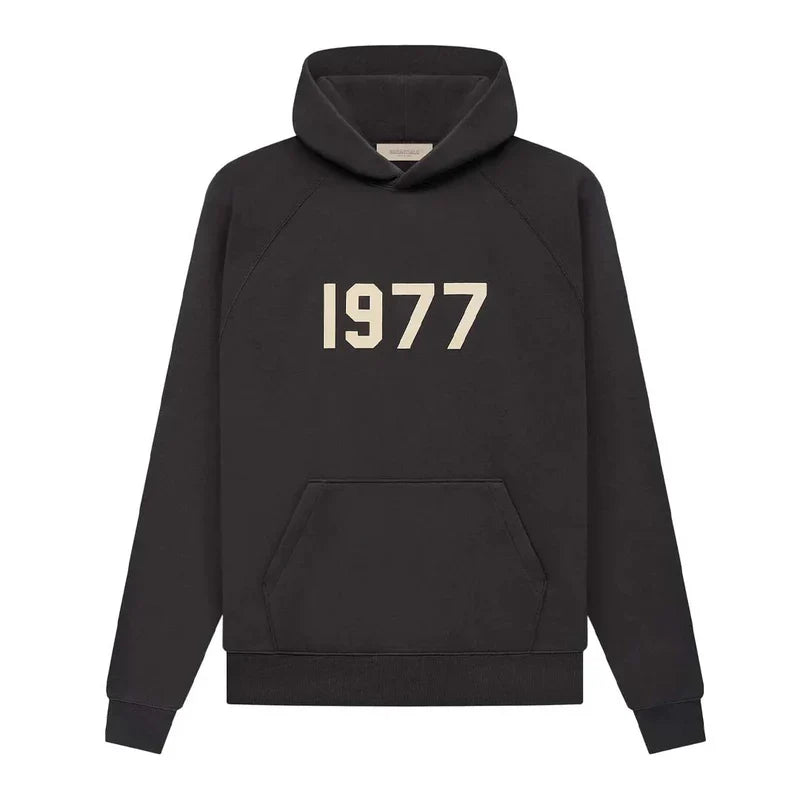 Fear of God Essentials 1977 Hoodie in iron color, casual fit, with hood and front pocket, from THE EA STORE.