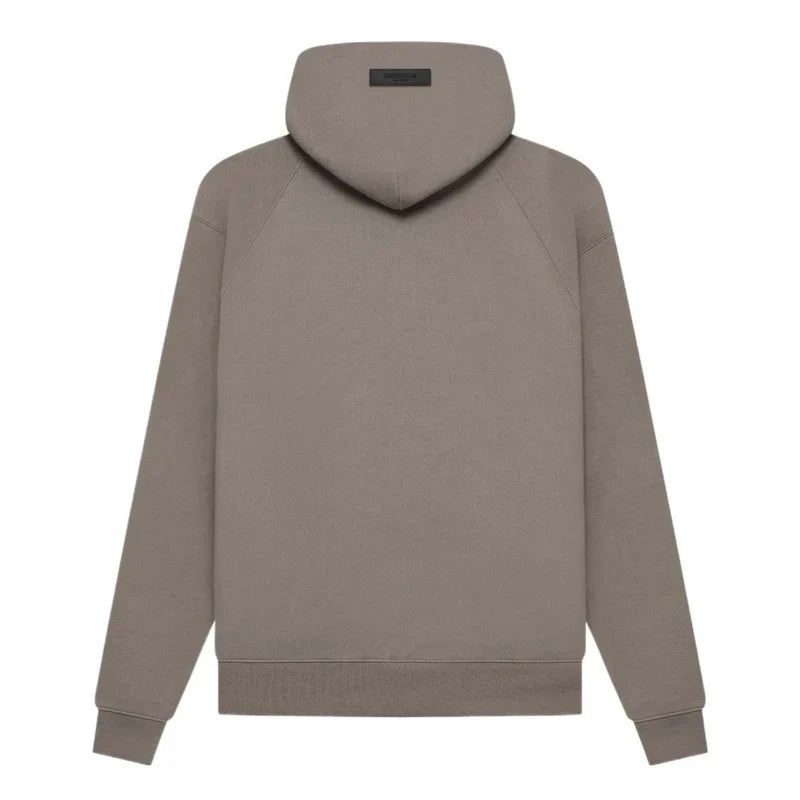 Fear of God Essentials hoodie in desert taupe, featuring a soft fabric and relaxed fit, styled on a model.