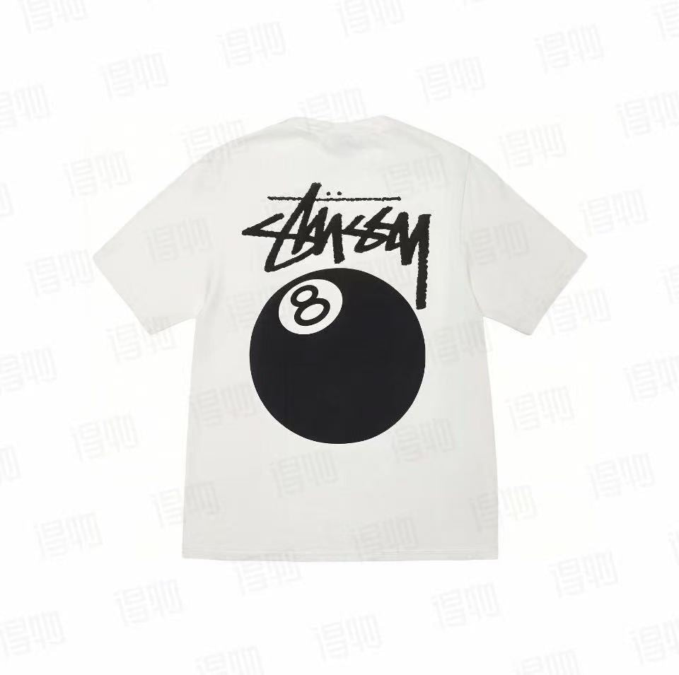 White Stussy 8 Ball Tee from THE EA STORE Essentials collection, featuring a prominent 8 ball graphic on the front.