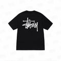 Black Stussy Basic Applique Logo Tee from THE EA STORE, featuring a simple logo design on a classic t-shirt.