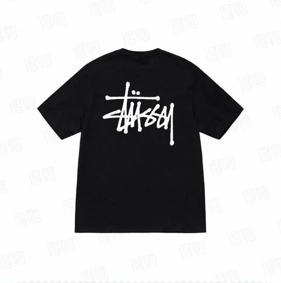 Black Stussy Basic Applique Logo Tee from THE EA STORE, featuring a simple logo design on a classic t-shirt.