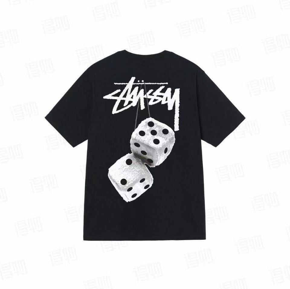 Black Stussy Fuzzy Dice Tee from THE EA STORE, featuring a casual essentials T-shirt with fuzzy dice graphic on the front.
