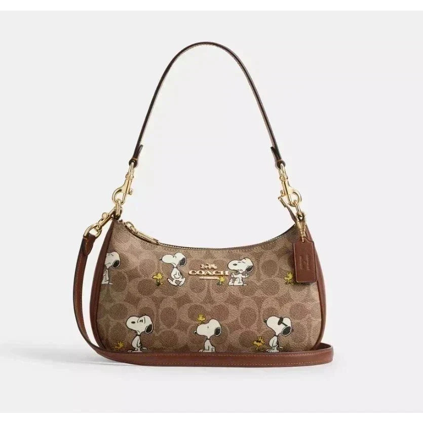 Coach Teri Shoulder Bag in signature canvas with gold, tan, and brown tones, featuring a classic shoulder bag design.